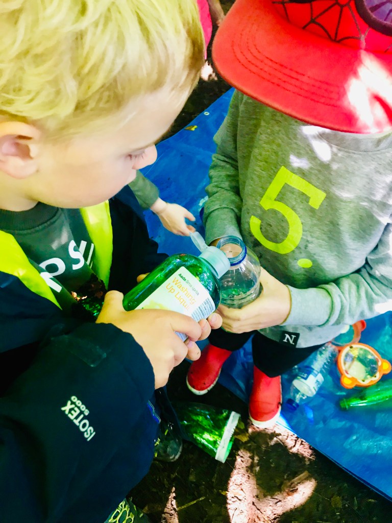Learning about liquid densities with friends at outdoor STEM sessions in Glasgow, Scotland