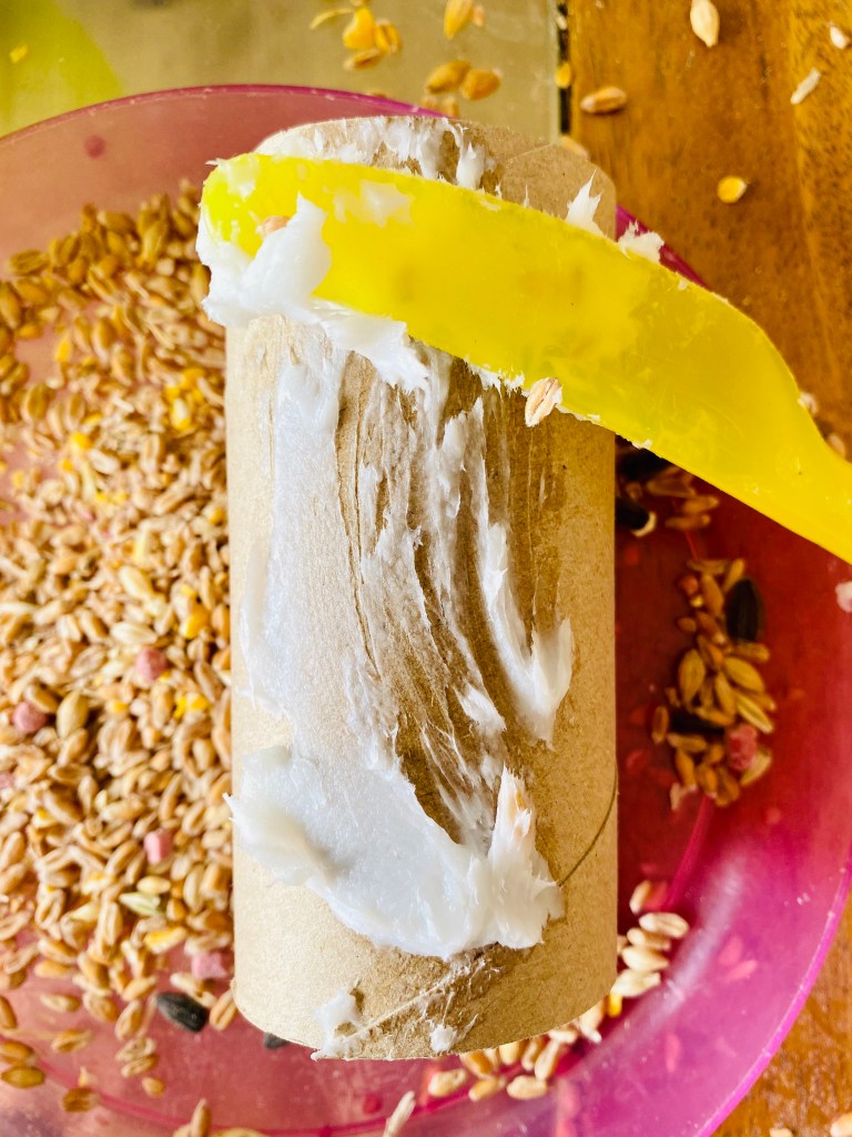 Using lard to create homemade bird feeders with kids