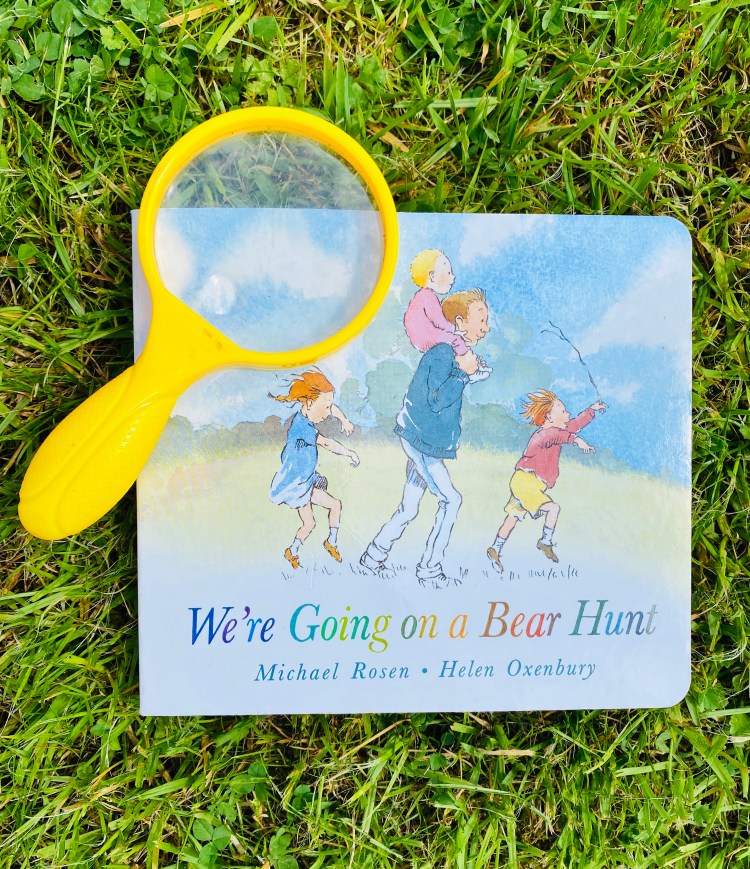 We're going on a bear hunt book with magnifying glass
